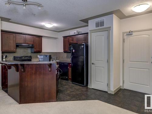 109 4415 48 Street, Leduc, AB - Indoor Photo Showing Kitchen