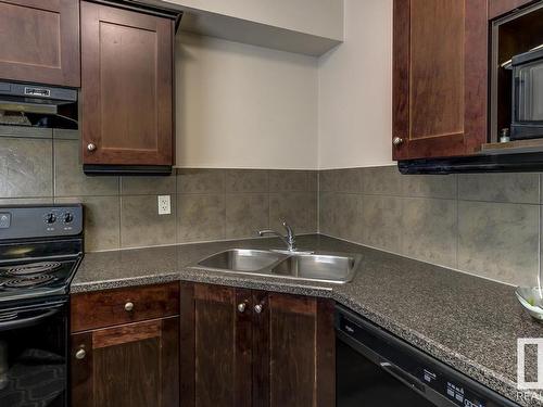 109 4415 48 Street, Leduc, AB - Indoor Photo Showing Kitchen With Double Sink