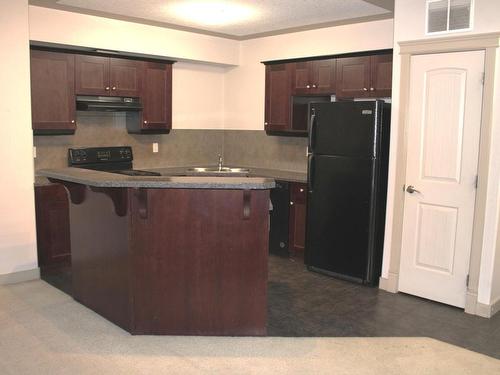 109 4415 48 Street, Leduc, AB - Indoor Photo Showing Kitchen With Double Sink