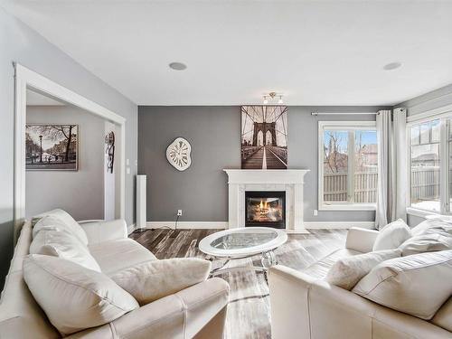 237 Ambleside Drive Sw, Edmonton, AB - Indoor Photo Showing Living Room With Fireplace