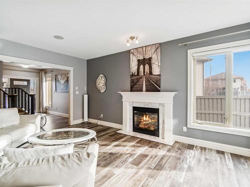 237 Ambleside Drive Sw, Edmonton, AB - Indoor Photo Showing Living Room With Fireplace