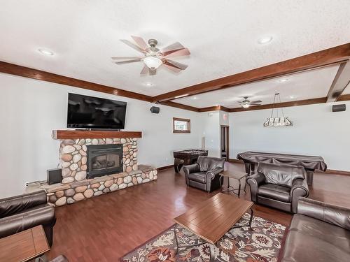 542 55101 Ste. Anne Trail, Rural Lac Ste. Anne County, AB - Indoor Photo Showing Living Room With Fireplace