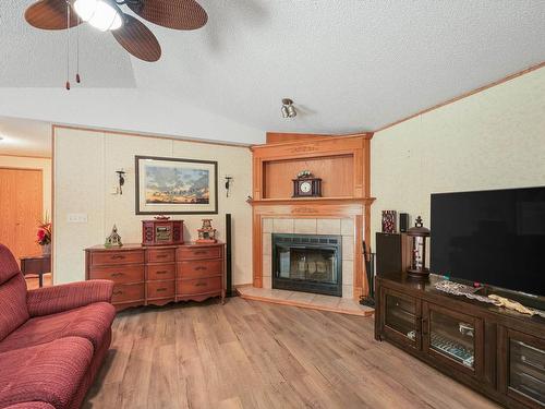 49 Neilson Dr., Rural Athabasca County, AB - Indoor Photo Showing Living Room With Fireplace