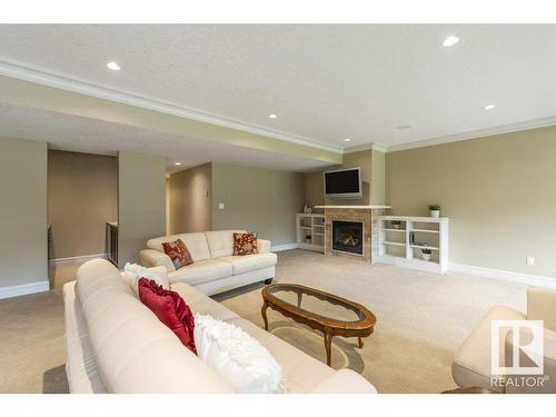 80 Riverstone Close, Rural Sturgeon County, AB - Indoor Photo Showing Living Room With Fireplace