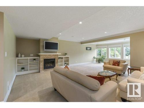 80 Riverstone Close, Rural Sturgeon County, AB - Indoor Photo Showing Living Room With Fireplace