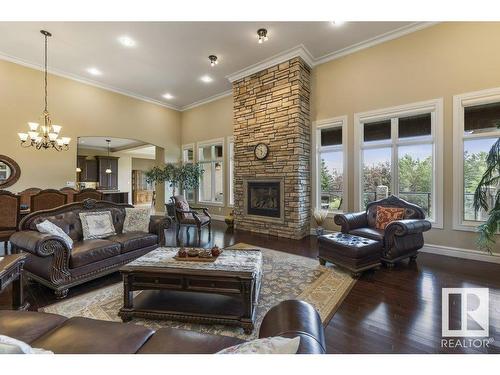 80 Riverstone Close, Rural Sturgeon County, AB - Indoor Photo Showing Living Room With Fireplace