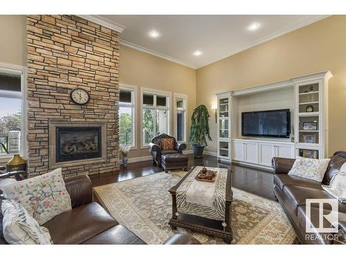 80 Riverstone Close, Rural Sturgeon County, AB - Indoor Photo Showing Living Room With Fireplace