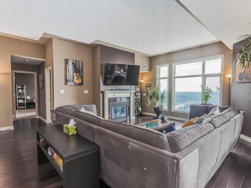 1705 9020 Jasper Avenue, Edmonton, AB - Indoor Photo Showing Living Room With Fireplace