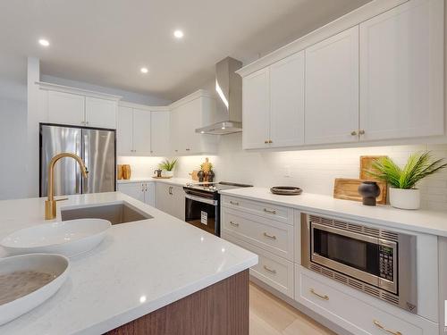 166 Stonehouse Way, Leduc, AB - Indoor Photo Showing Kitchen With Stainless Steel Kitchen With Upgraded Kitchen