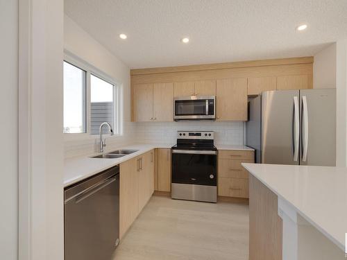 2448 Trumpeter Way, Edmonton, AB - Indoor Photo Showing Kitchen With Stainless Steel Kitchen With Double Sink