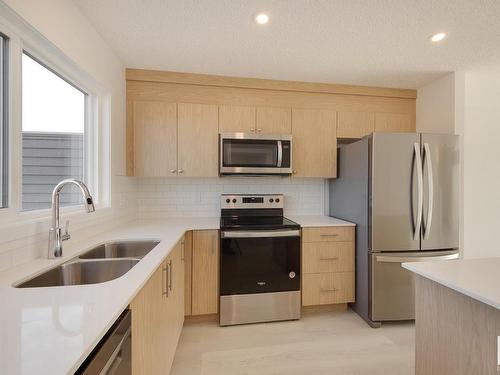 2448 Trumpeter Way, Edmonton, AB - Indoor Photo Showing Kitchen With Stainless Steel Kitchen With Double Sink