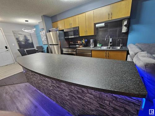 410 10118 106 Avenue, Edmonton, AB - Indoor Photo Showing Kitchen With Stainless Steel Kitchen With Double Sink