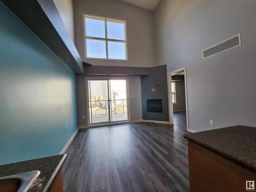 410 10118 106 Avenue, Edmonton, AB - Indoor Photo Showing Other Room With Fireplace