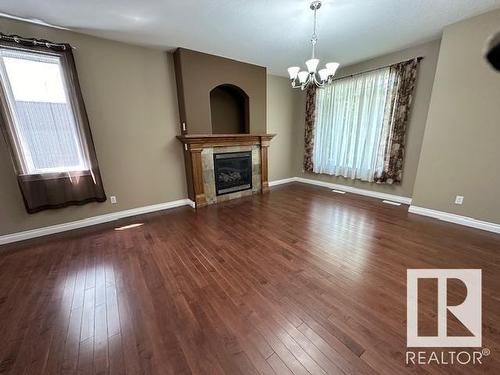 8747- 83 Avenue Nw, Edmonton, AB - Indoor Photo Showing Living Room With Fireplace