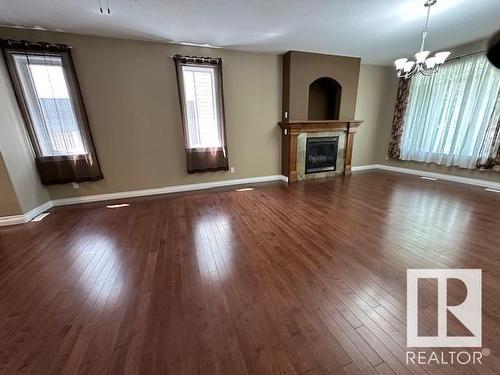 8747- 83 Avenue Nw, Edmonton, AB - Indoor Photo Showing Other Room With Fireplace