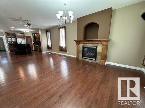 8747- 83 Avenue Nw, Edmonton, AB - Indoor Photo Showing Living Room With Fireplace