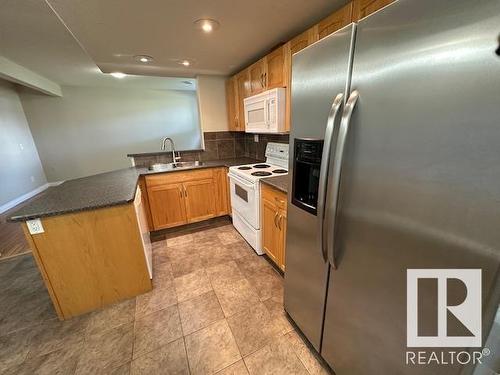 8747- 83 Avenue Nw, Edmonton, AB - Indoor Photo Showing Kitchen With Double Sink