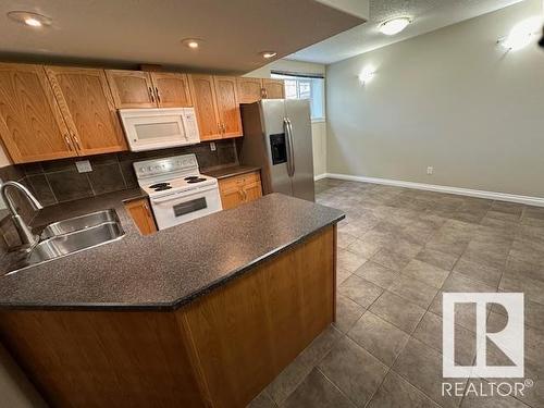 8747- 83 Avenue Nw, Edmonton, AB - Indoor Photo Showing Kitchen With Double Sink