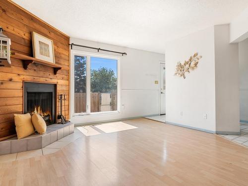 8612 38A Avenue, Edmonton, AB - Indoor Photo Showing Living Room With Fireplace