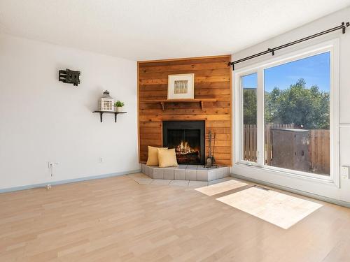 8612 38A Avenue, Edmonton, AB - Indoor Photo Showing Living Room With Fireplace