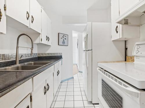 8612 38A Avenue, Edmonton, AB - Indoor Photo Showing Kitchen With Double Sink