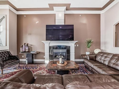 26116 A Highway 16, Rural Parkland County, AB - Indoor Photo Showing Living Room With Fireplace