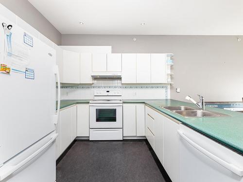 403 11415 100 Avenue, Edmonton, AB - Indoor Photo Showing Kitchen With Double Sink