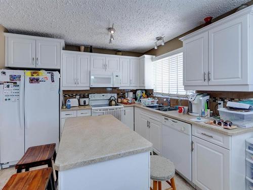 10524 110 Street, Westlock, AB - Indoor Photo Showing Kitchen With Double Sink