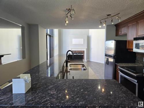 104 9020 Jasper Avenue, Edmonton, AB - Indoor Photo Showing Kitchen With Double Sink