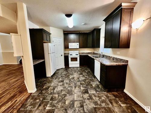 5029 51 Avenue, St. Paul Town, AB - Indoor Photo Showing Kitchen With Double Sink