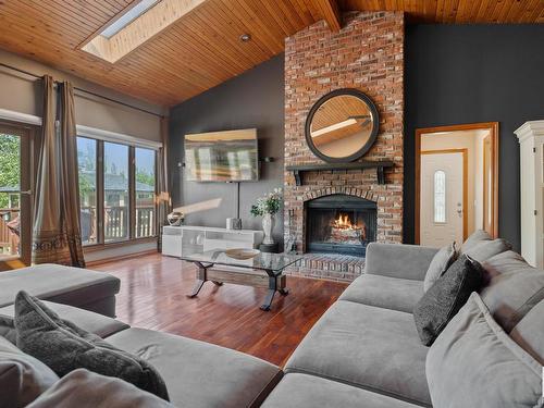 40-54006 Rge Rd 261, Rural Sturgeon County, AB - Indoor Photo Showing Living Room With Fireplace