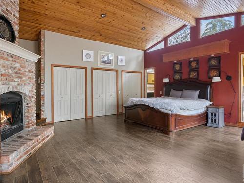 40-54006 Rge Rd 261, Rural Sturgeon County, AB - Indoor Photo Showing Bedroom With Fireplace