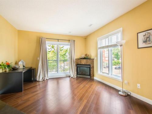 202 7907 109 Street, Edmonton, AB - Indoor Photo Showing Living Room With Fireplace