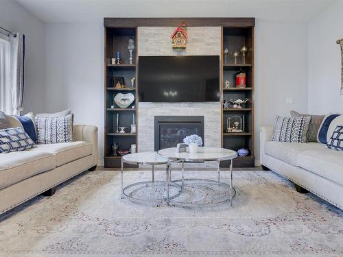 8452 Cushing Court, Edmonton, AB - Indoor Photo Showing Living Room With Fireplace