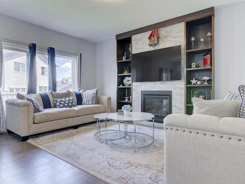 8452 Cushing Court, Edmonton, AB - Indoor Photo Showing Living Room With Fireplace