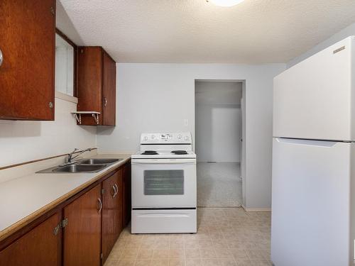 10440 University Avenue, Edmonton, AB - Indoor Photo Showing Kitchen With Double Sink