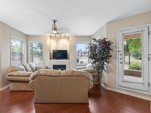 101 10346 117 Street, Edmonton, AB - Indoor Photo Showing Living Room With Fireplace