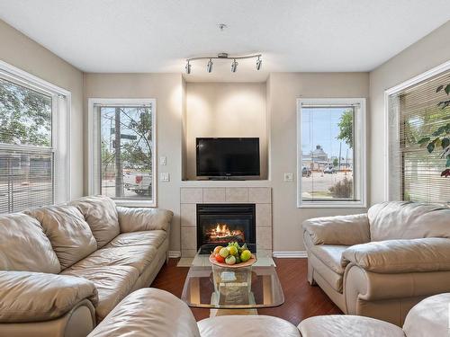 101 10346 117 Street, Edmonton, AB - Indoor Photo Showing Living Room With Fireplace