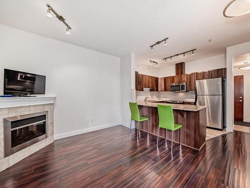 117 10333 112 Street, Edmonton, AB - Indoor Photo Showing Kitchen With Fireplace