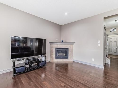 3342 18A Avenue, Edmonton, AB - Indoor Photo Showing Living Room With Fireplace