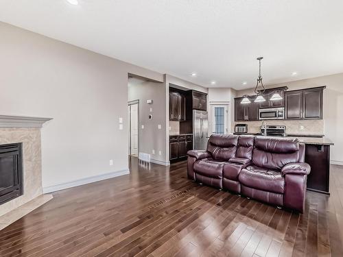 3342 18A Avenue, Edmonton, AB - Indoor Photo Showing Living Room With Fireplace