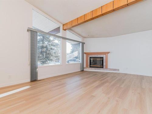 4828 122A Street, Edmonton, AB - Indoor Photo Showing Living Room With Fireplace