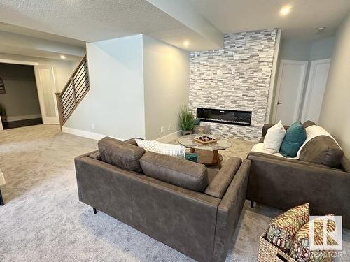 6 Hayfield Grove, Ardrossan, AB - Indoor Photo Showing Living Room With Fireplace