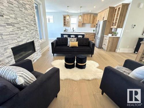 6 Hayfield Grove, Ardrossan, AB - Indoor Photo Showing Living Room With Fireplace