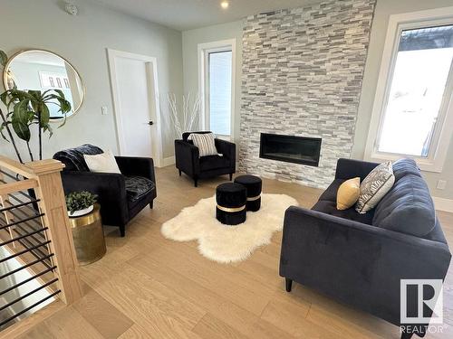 6 Hayfield Grove, Ardrossan, AB - Indoor Photo Showing Living Room With Fireplace