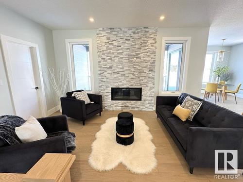 6 Hayfield Grove, Ardrossan, AB - Indoor Photo Showing Living Room With Fireplace