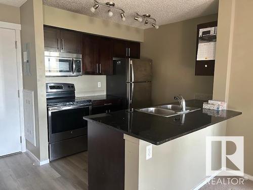 Edmonton, AB - Indoor Photo Showing Kitchen With Stainless Steel Kitchen With Double Sink