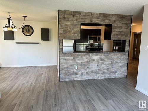 446 10636 120 Street, Edmonton, AB - Indoor With Fireplace