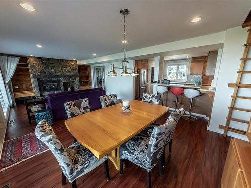 102 Parkins Avenue, Rural Lac Ste. Anne County, AB - Indoor Photo Showing Dining Room With Fireplace