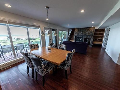 102 Parkins Avenue, Rural Lac Ste. Anne County, AB - Indoor Photo Showing Dining Room With Fireplace